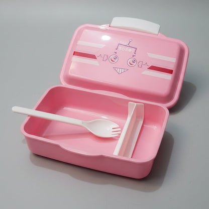 A pink plastic lunch box shown open on a light marble-like surface, with a white plastic fork resting inside and a white divider insert. The lid features a cartoon face graphic with the word ROBO.